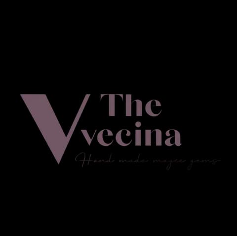 Logotipo de The Vecina, cliente de XVTRENDS